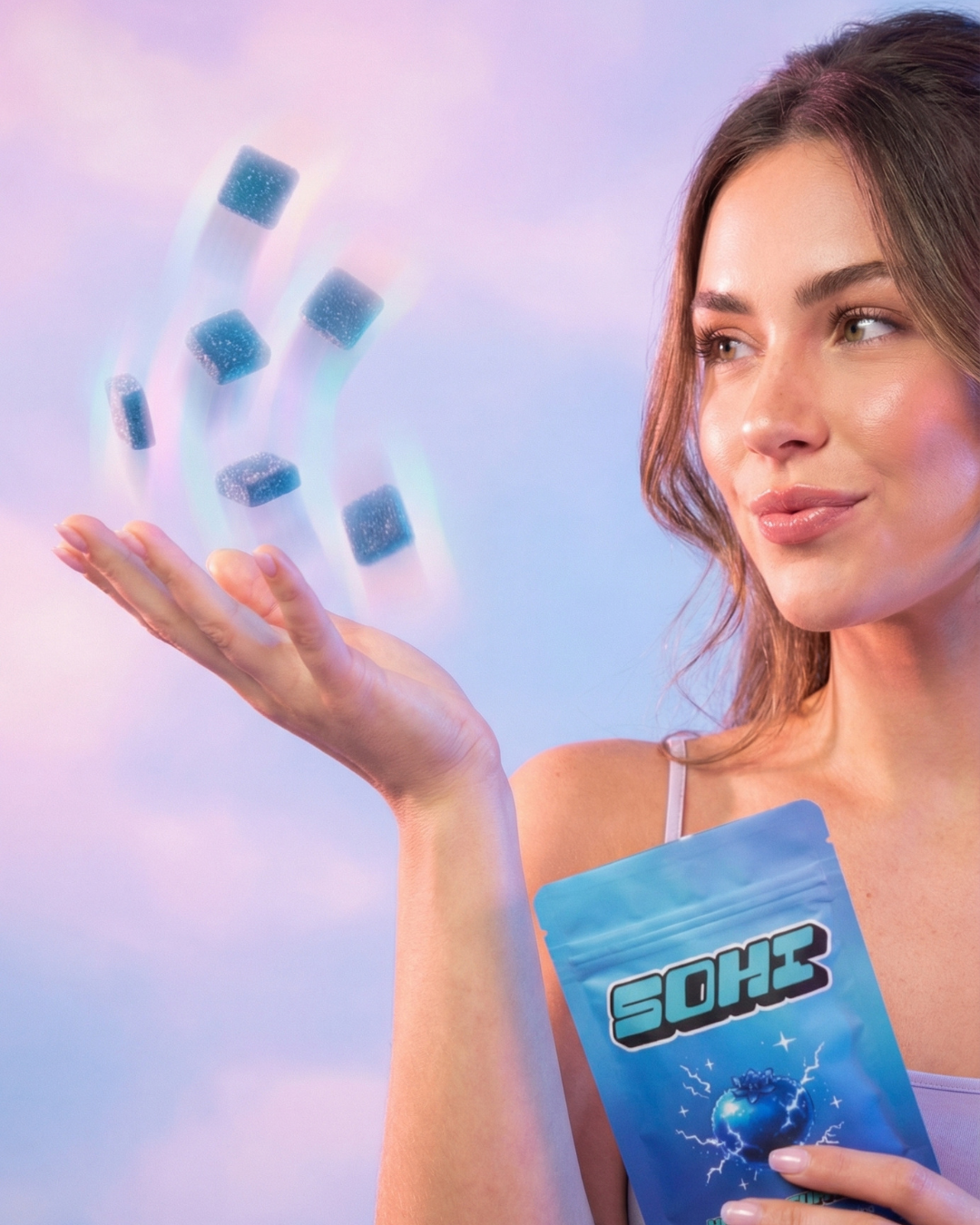 Model with SOHI Blue Razz Bliss gummies